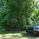 The Honda sits in my landlord’s driveway. I live in that light blue house in the background.